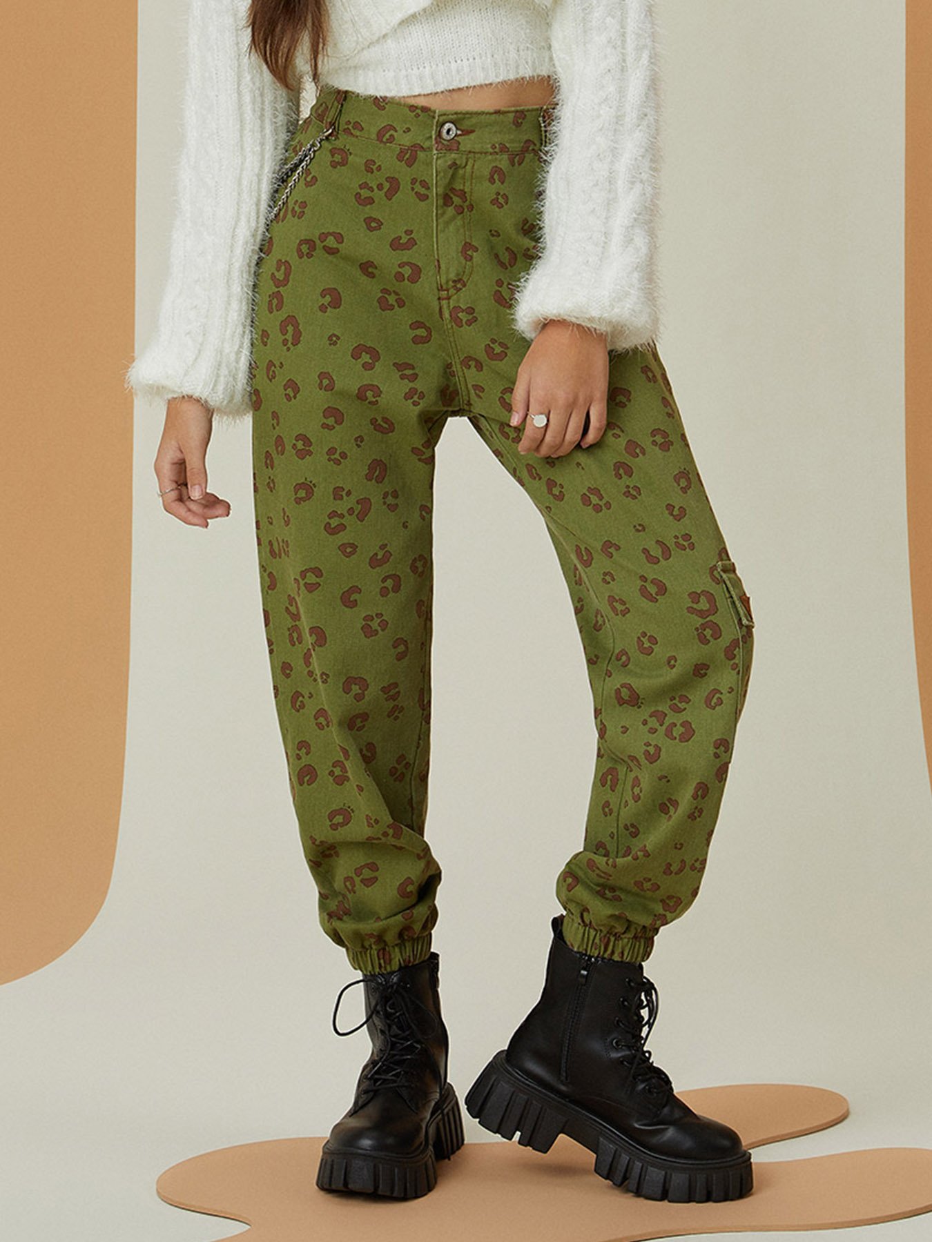 nike all over logo print joggers in camel